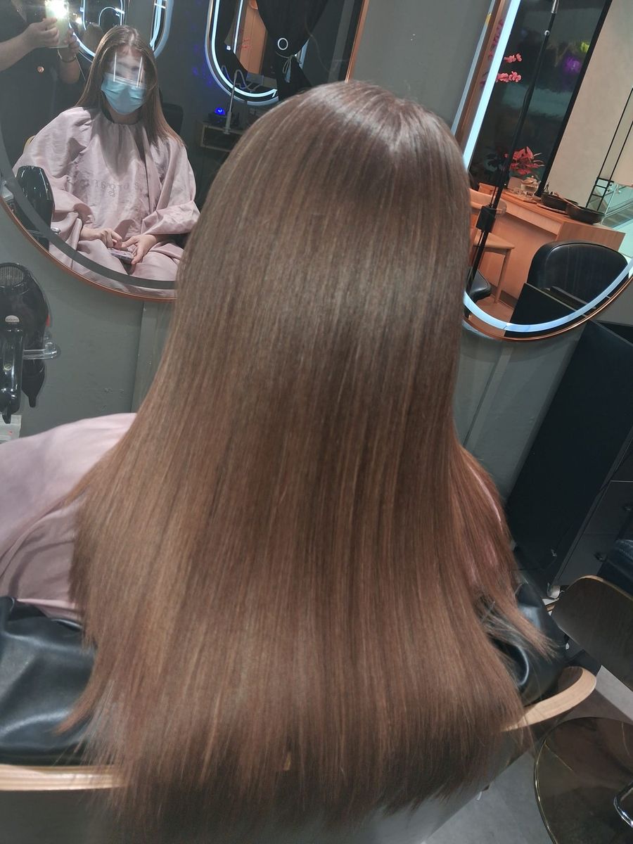 Soft, straight brunette hair with a healthy natural shine